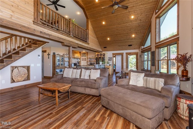 living room featuring ceiling fan, hardwood / wood-style floors, high vaulted ceiling, and wood ceiling