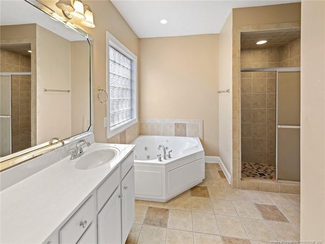 bathroom featuring tile patterned flooring, vanity, and independent shower and bath