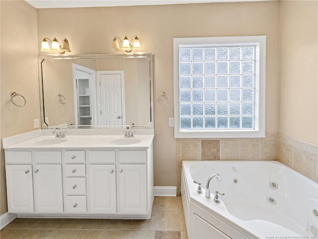 bathroom with vanity, a tub to relax in, and a wealth of natural light