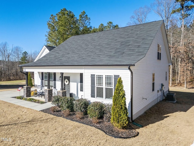 view of front of property with covered porch and central AC