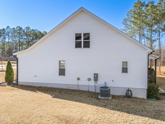 view of side of property featuring cooling unit