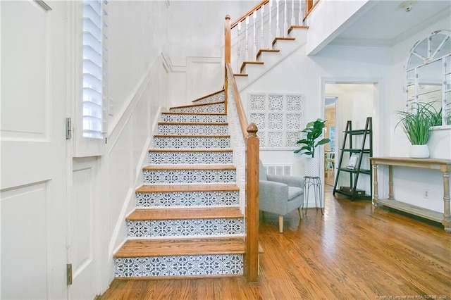 staircase featuring hardwood / wood-style flooring