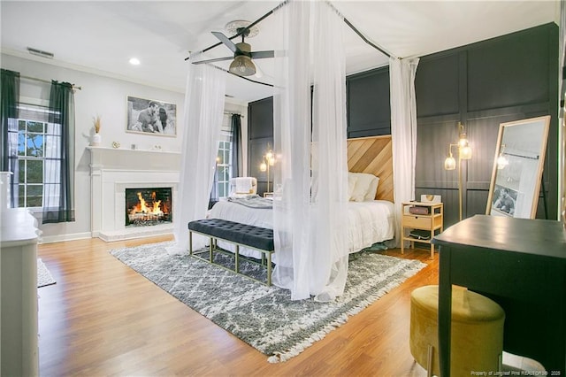 bedroom with wood-type flooring and ceiling fan