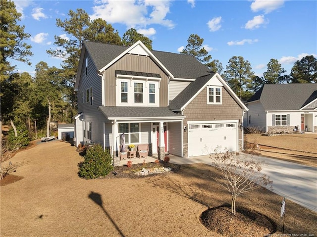 view of front facade featuring a garage and covered porch