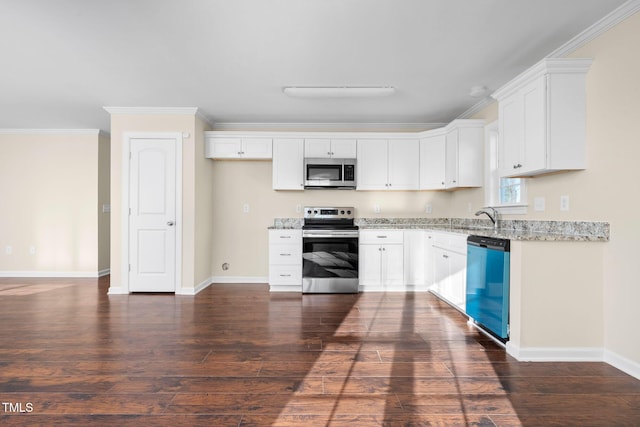 kitchen featuring white cabinets, light stone countertops, stainless steel appliances, and ornamental molding