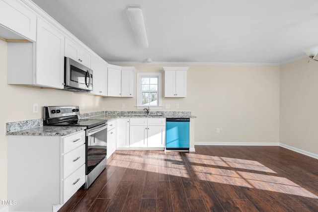 kitchen with stainless steel appliances, white cabinetry, dark hardwood / wood-style floors, and light stone counters