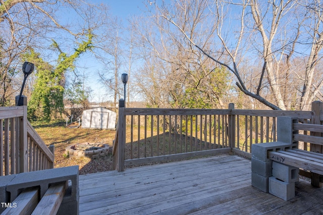 wooden terrace with a storage unit