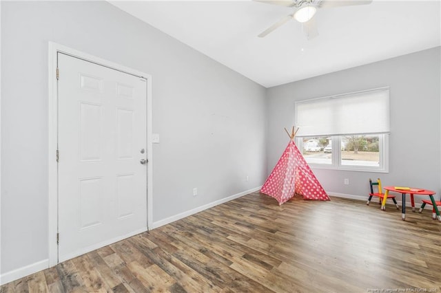 playroom featuring ceiling fan and hardwood / wood-style flooring