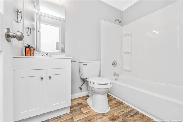 full bathroom with vanity, hardwood / wood-style flooring, toilet, and shower / washtub combination