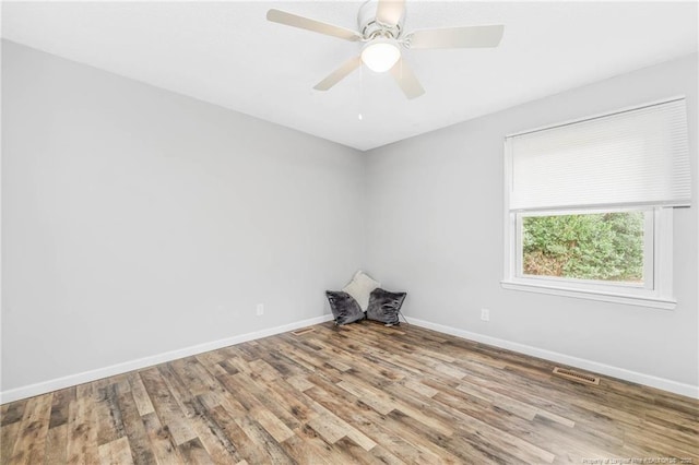 unfurnished room featuring ceiling fan and light hardwood / wood-style floors