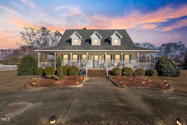 farmhouse inspired home with covered porch