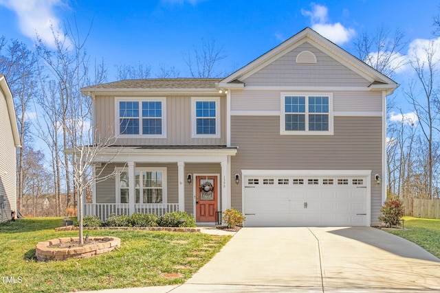 view of front of home with a garage, a front yard, and a porch