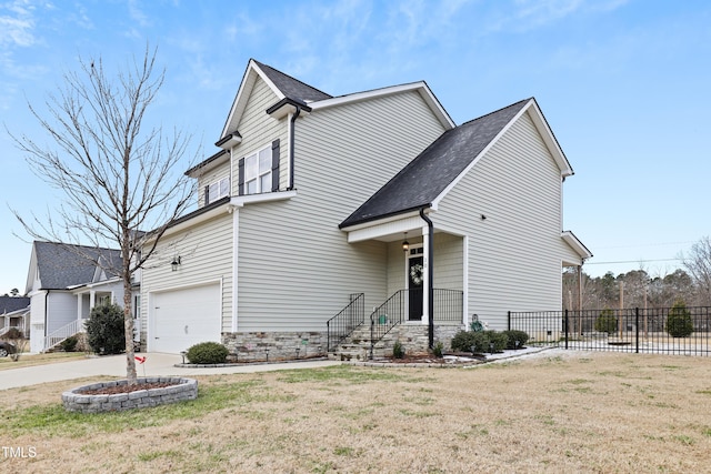 view of front of home featuring a garage and a front yard