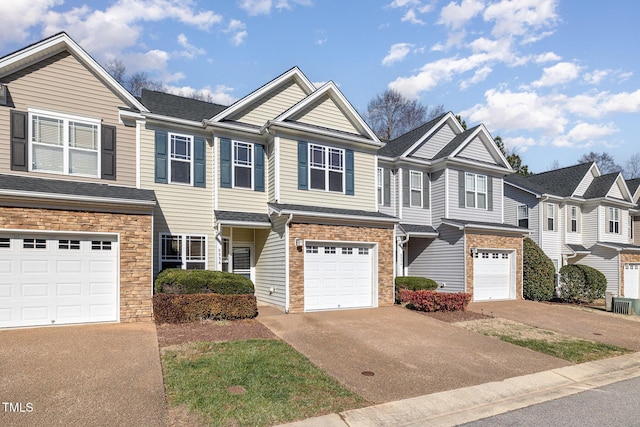 multi unit property featuring a garage