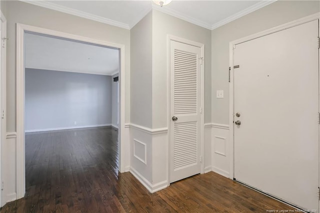 entrance foyer featuring dark wood-type flooring and ornamental molding