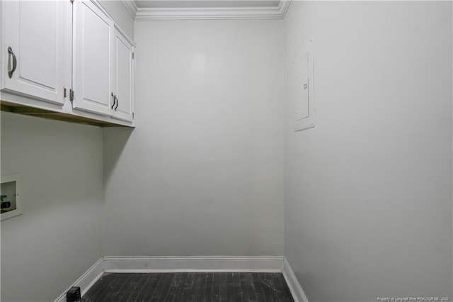 washroom with cabinets, hookup for a washing machine, electric panel, and ornamental molding