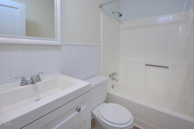 full bathroom featuring bathing tub / shower combination, vanity, and toilet