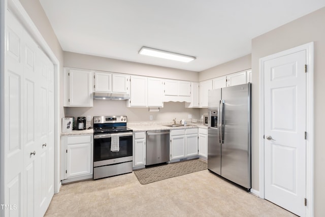 kitchen with white cabinets, appliances with stainless steel finishes, and sink