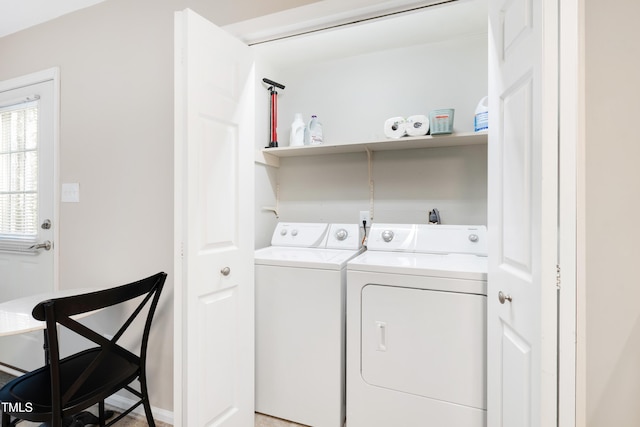 washroom featuring washing machine and dryer