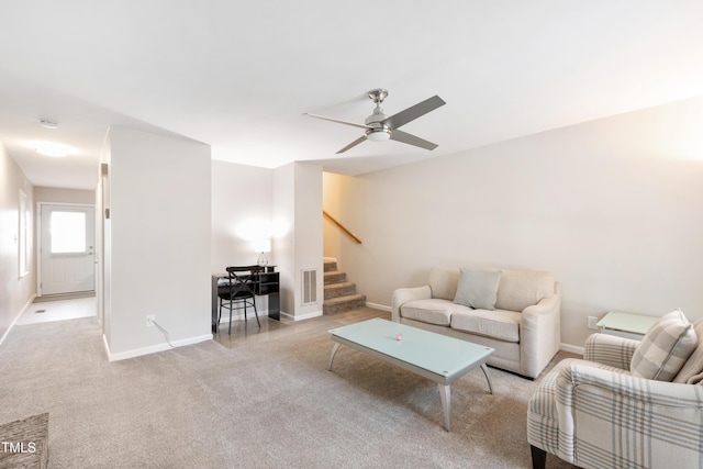 living room featuring ceiling fan and light carpet