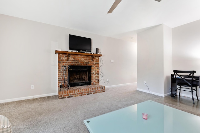 living room featuring a fireplace, ceiling fan, and carpet flooring