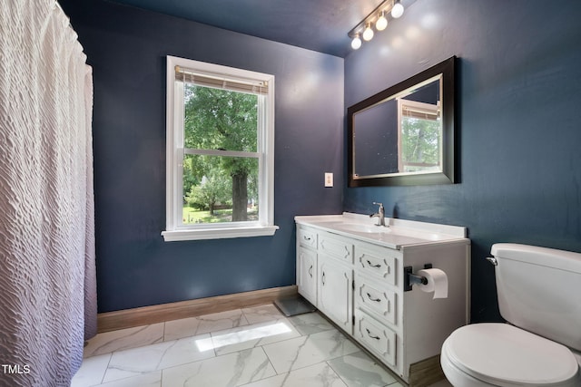 bathroom featuring vanity and toilet