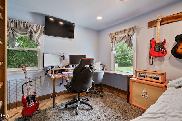 home office with wood-type flooring