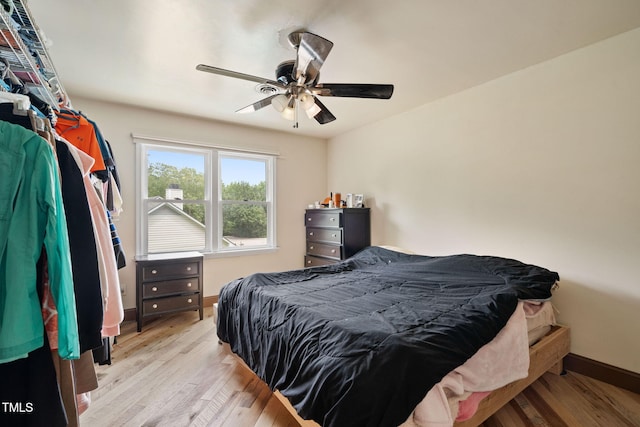 bedroom featuring ceiling fan and light hardwood / wood-style floors