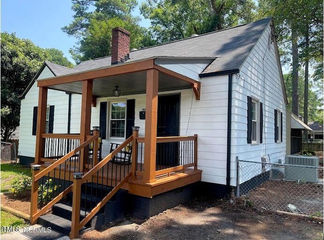 rear view of house with a porch