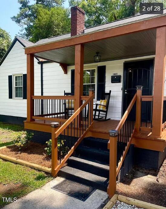 doorway to property with a porch