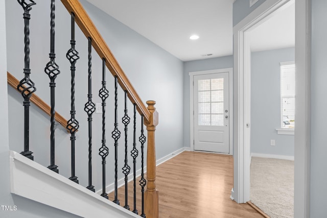 entrance foyer with plenty of natural light and light wood-type flooring