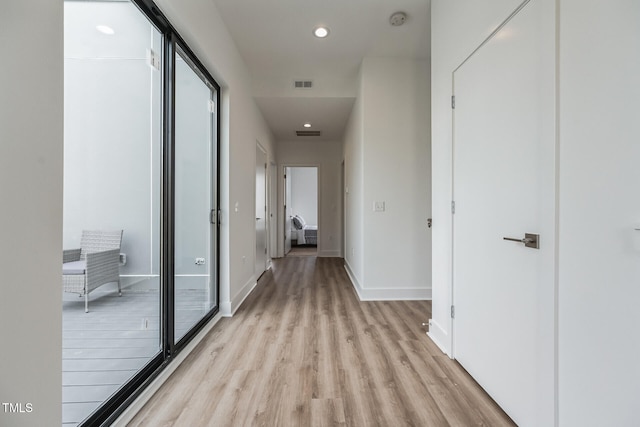 hallway featuring light hardwood / wood-style flooring