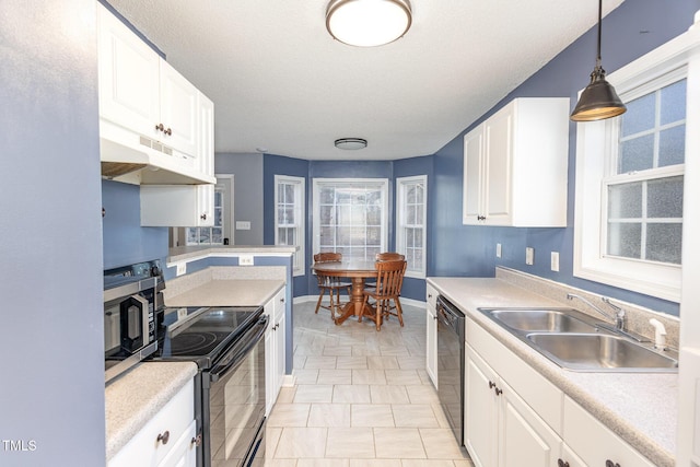 kitchen featuring a textured ceiling, black appliances, white cabinetry, sink, and hanging light fixtures