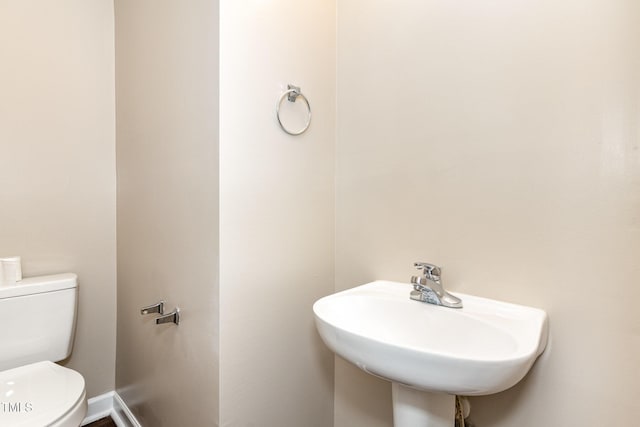 bathroom with sink and toilet