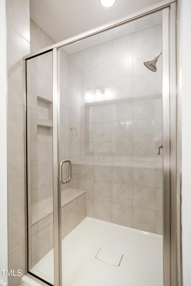 bathroom with an enclosed shower