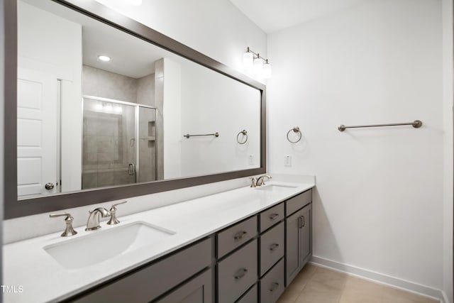 bathroom featuring vanity, tile patterned floors, and walk in shower