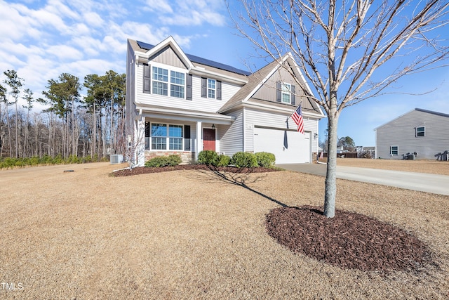 view of front of house with a porch and a garage