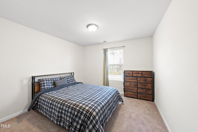 bedroom featuring carpet