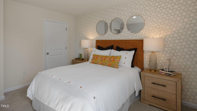 bedroom featuring light colored carpet