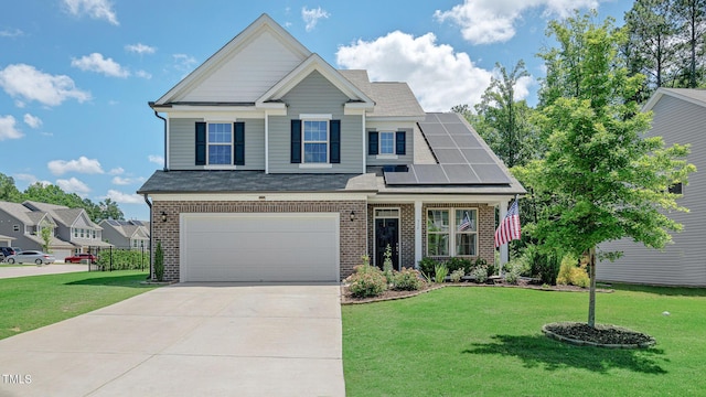 view of front of home with a front yard, solar panels, and a garage