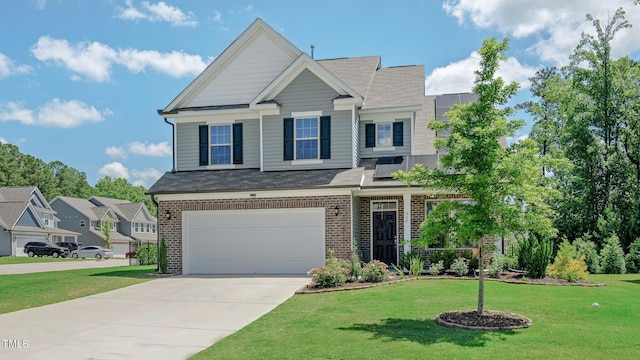 craftsman house featuring a front yard and a garage