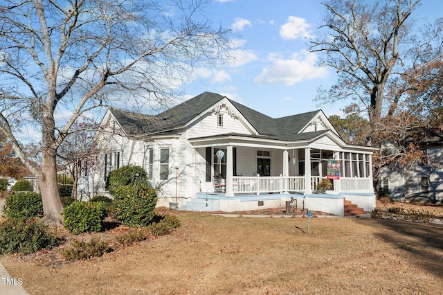 view of front of property with a porch and a front yard