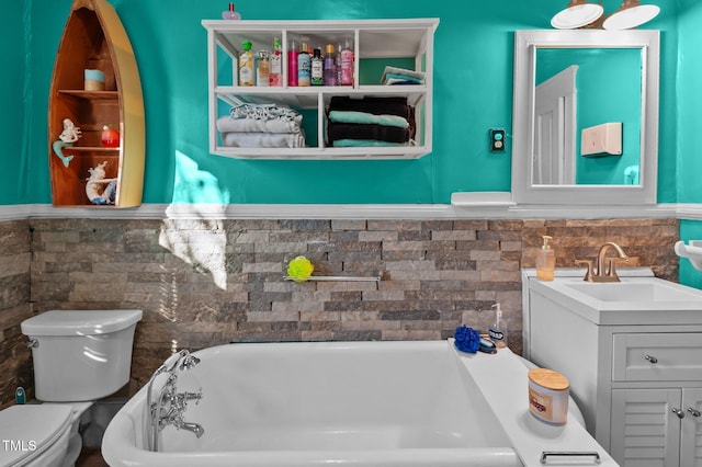 bathroom featuring backsplash, vanity, toilet, and a bath