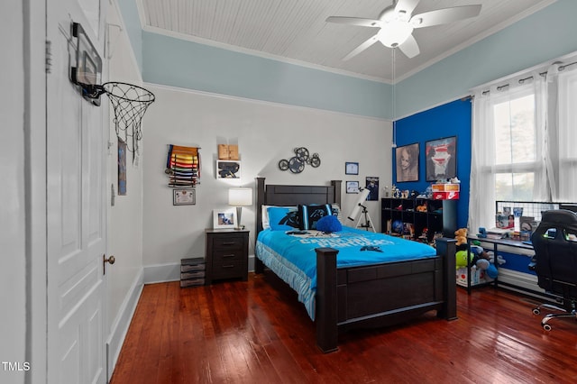 bedroom featuring dark hardwood / wood-style floors, ceiling fan, and crown molding