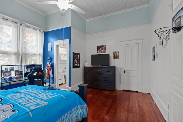 bedroom with connected bathroom, crown molding, ceiling fan, and dark wood-type flooring