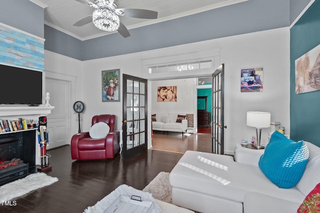 living room with french doors, dark hardwood / wood-style flooring, ceiling fan, and ornamental molding