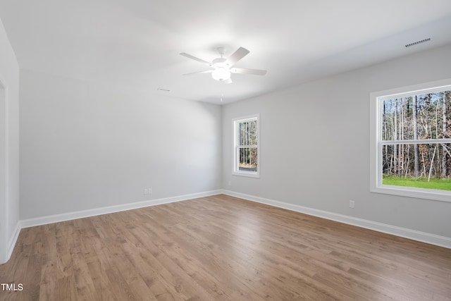 625 Spellbrook Rd, Zebulon, NC 27597 - unfurnished room with visible vents, baseboards, light wood-style floors, and ceiling fan