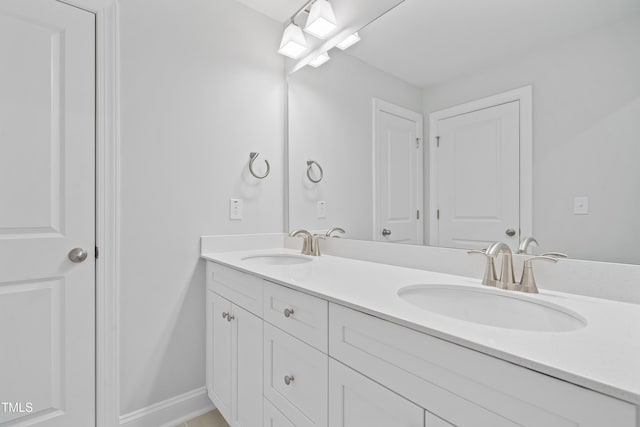 625 Spellbrook Rd, Zebulon, NC 27597 - full bath featuring double vanity, baseboards, and a sink