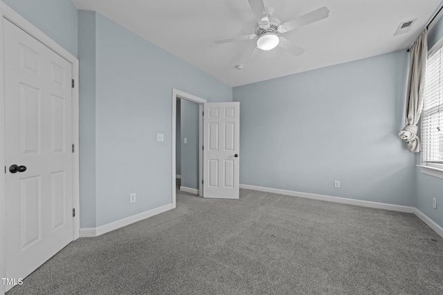 unfurnished bedroom with ceiling fan and carpet floors