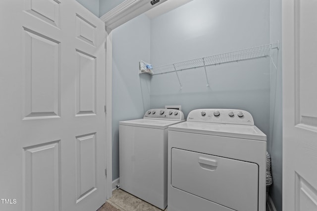 washroom with washer and clothes dryer